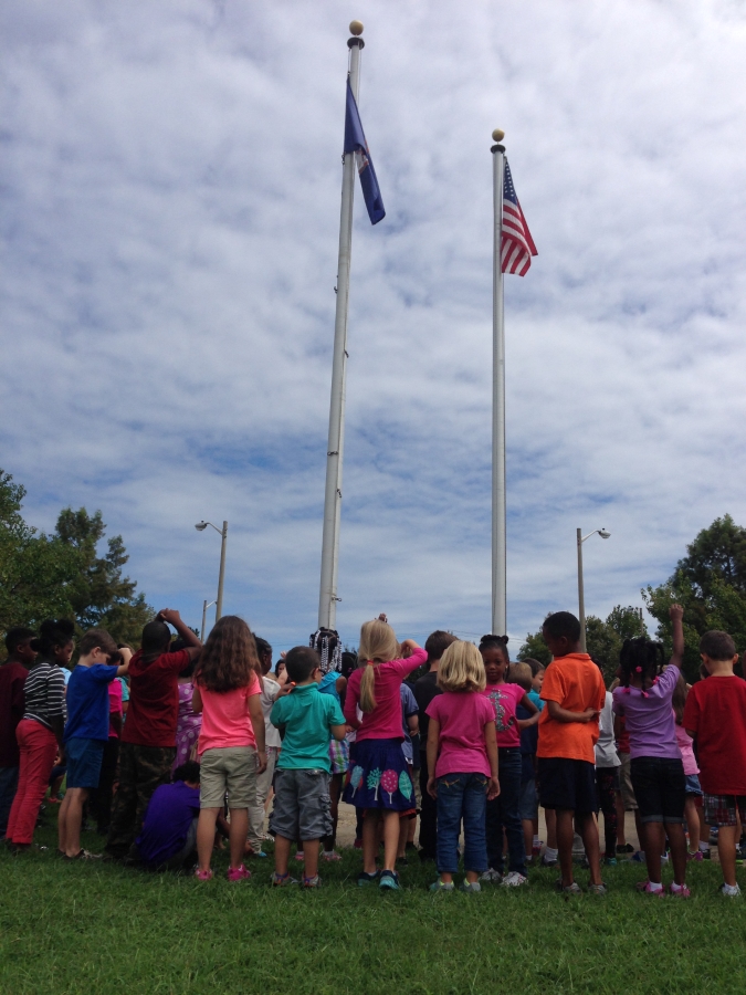 NSES students at flagpole